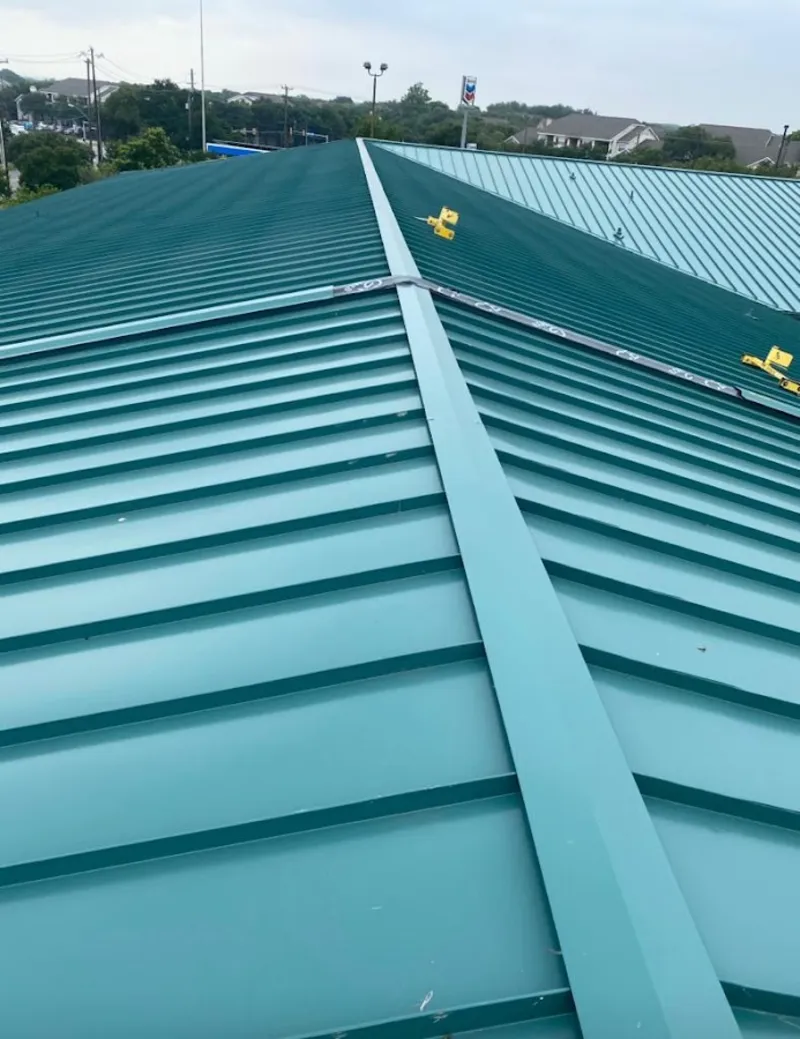 Green commercial metal roof ridge and valley for Metal Roof Repair in Elbridge